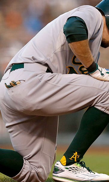 Ouch! A's Burns fouls ball off groin, leaves game with 'testicular contusion'